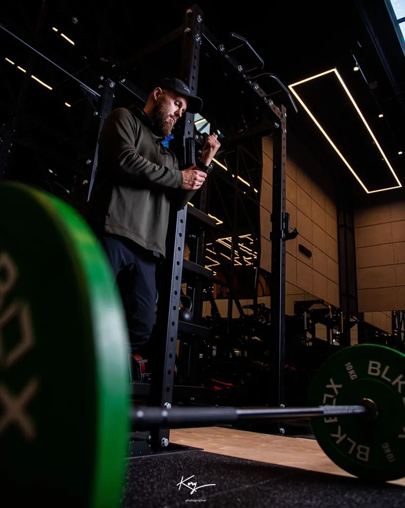Branko Lalicic preparing wrist wraps in the gym