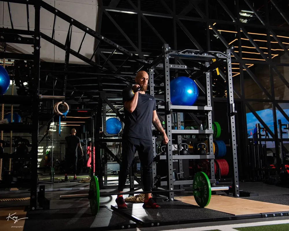 Kettlebell rack carry in the gym
